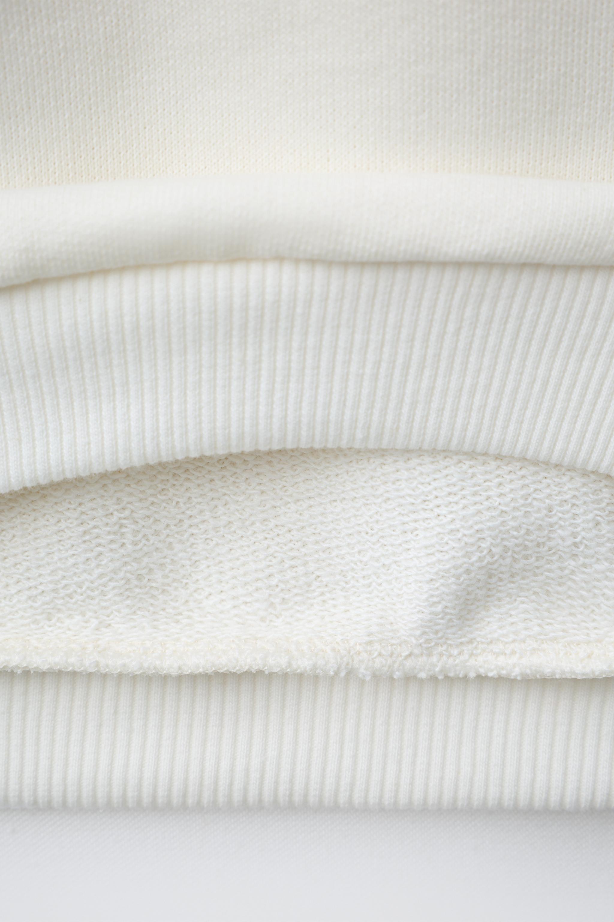 STRIPED HEART PATCH SWEATSHIRT